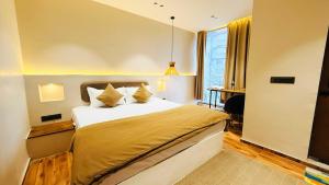 Ένα ή περισσότερα κρεβάτια σε δωμάτιο στο Hotel COCODAN