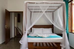 Postel nebo postele na pokoji v ubytování Tekkawatta + 69 fotografií