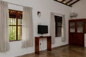 TV a/nebo společenská místnost v ubytování Tekkawatta