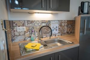 a kitchen with a sink and a counter top at Kara Ben Nemsi in Ilmmünster +7 photos