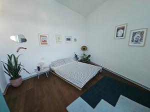 Postel nebo postele na pokoji v ubytování The Blue terrace