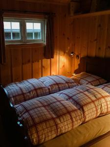 Postel nebo postele na pokoji v ubytování Modern Log Cabin By Hardangervidda + 13 fotografií