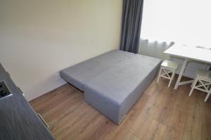 a bedroom with a bed and a table and chairs at Furnished apartment with a very good location in Kristiine in Tallinn