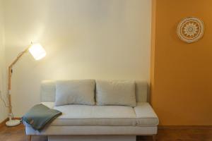 a couch in a living room with a lamp at Apartment Erde im Ferienhaus am Waldbach in Kirchzell