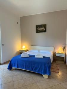 Ένα ή περισσότερα κρεβάτια σε δωμάτιο στο Le Palme Apartments