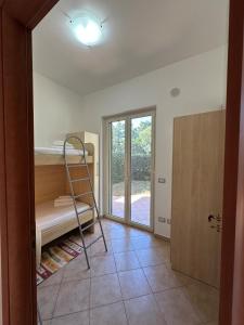 Ένα ή περισσότερα κρεβάτια σε δωμάτιο στο Le Palme Apartments