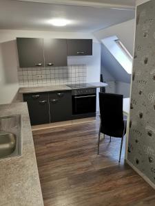 Η κουζίνα ή μικρή κουζίνα στο Am Wald der Sinne, DG