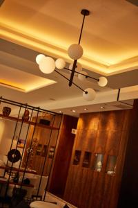 a ceiling with a chandelier in a room at MIM Sitges Member of Melia Collection in Sitges