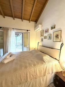 Postel nebo postele na pokoji v ubytování Traditional House Pouglia