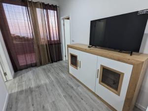 Μια τηλεόραση ή/και κέντρο ψυχαγωγίας στο Apartamento Laranjeiras dois