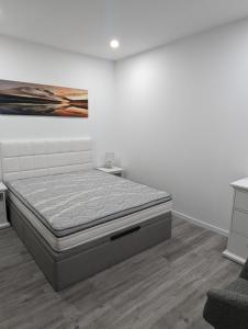 Ένα ή περισσότερα κρεβάτια σε δωμάτιο στο Apartamento Laranjeiras dois