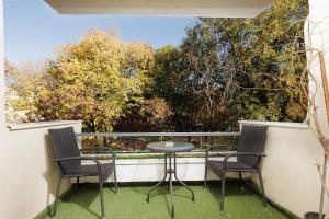 En balkon eller terrasse på By the Park