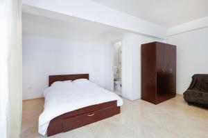 En eller flere senge i et værelse på By the Park