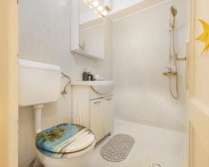 Et badeværelse på By the Park + 4 billeder