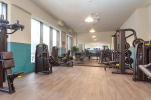 a gym with lots of treadmills and machines at Orchard by UTDM in Bristol