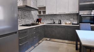 Η κουζίνα ή μικρή κουζίνα στο Villa Neviera Wine Resort & Spa by Cantine Due Palme