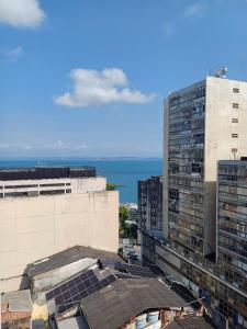 an aerial view of buildings and the ocean at Loft Salvador in Salvador