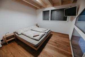 Ένα ή περισσότερα κρεβάτια σε δωμάτιο στο Rothorn- grosse, moderne Dachwohnung mit fantastischer Aussicht