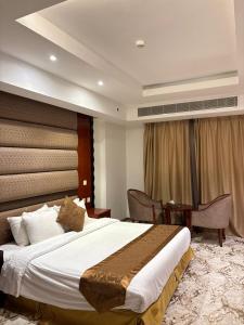 Ένα ή περισσότερα κρεβάτια σε δωμάτιο στο مدار سنام