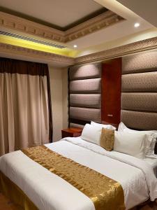 Ένα ή περισσότερα κρεβάτια σε δωμάτιο στο مدار سنام