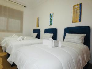 Ένα ή περισσότερα κρεβάτια σε δωμάτιο στο Appartement meuble rabat