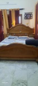 Una cama o camas en una habitación de DEVAA HOMESTAy