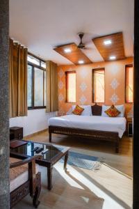 a bedroom with a large bed in a room at Rudrakshi Inn in Mount Ābu
