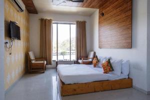 Postel nebo postele na pokoji v ubytování Rudra villas