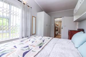 Ένα ή περισσότερα κρεβάτια σε δωμάτιο στο Die Steenbras