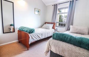 Ένα ή περισσότερα κρεβάτια σε δωμάτιο στο Die Steenbras +13 φωτογραφίες