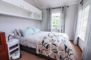 Ένα ή περισσότερα κρεβάτια σε δωμάτιο στο Die Steenbras