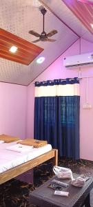 Ένα ή περισσότερα κρεβάτια σε δωμάτιο στο Unicorn Resort