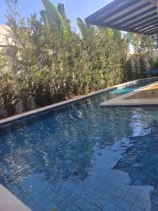 Πισίνα στο ή κοντά στο Casa em Condomínio de luxo, ao lado do Autódromo de Goiânia