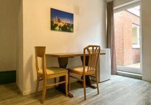 Posezení v ubytování Ruime accommodatie voor 12 personen op begane grond