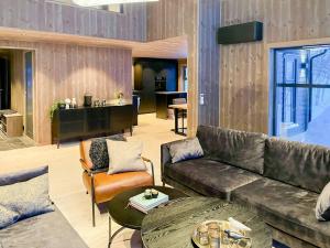 a living room with a couch and a table at Mountain Cabin At Hardangervidda in Uvdal