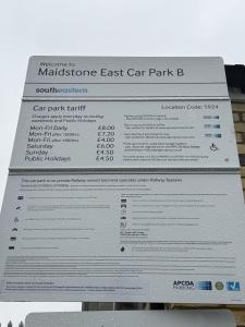 a stack of car park permits on a car park sign at Modern Studio - Centre Maidstone in Maidstone