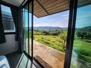 a view from the window of a room at the cabin hulk เขาใหญ่ in Ban Nong Song Hong