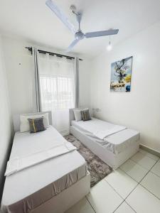 Postel nebo postele na pokoji v ubytování Comfort Home 2Bedroom Buxton point Mombasa