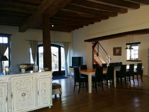 a dining room with a table and chairs at Maison 1 in Souvigny