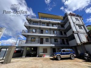a building with a car parked in front of it at Pan-Ogifan Transient in Baguio