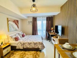 Postel nebo postele na pokoji v ubytování Johs Condotel