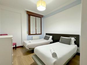 Postel nebo postele na pokoji v ubytování Santuchu Apartamento Elegante con wifi