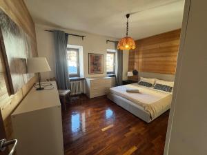 Ένα ή περισσότερα κρεβάτια σε δωμάτιο στο Cadore Flat - il Tuo Rifugio tra le Montagne +6 φωτογραφίες