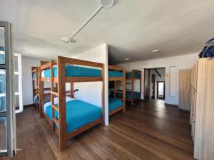 a room with four bunk beds in it at Holis in Sucre