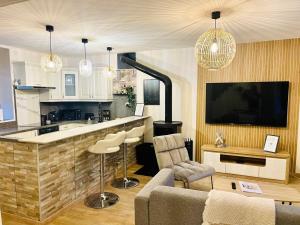 Et tv og/eller underholdning på La maison de la Petite Martinières