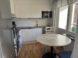 Η κουζίνα ή μικρή κουζίνα στο Kungsbacken Apartments AB - Bondegatan 32