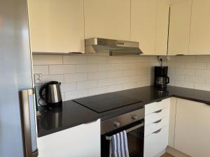 Η κουζίνα ή μικρή κουζίνα στο Kungsbacken Apartments AB - Bondegatan 32
