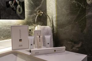 a group of boxes sitting on a counter in a bathroom at Jovan suites apartment in AlUla +17 photos