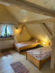 Postel nebo postele na pokoji v ubytování Siedlisko Błominko