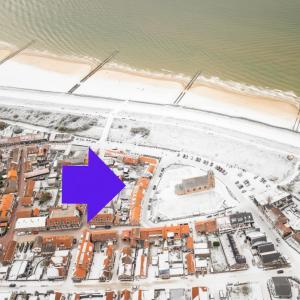 a map of a city with a purple arrow at Family Retreat Zoutelande Beach in Zoutelande